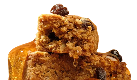 Stack of glazed oat bars, drizzled with honey