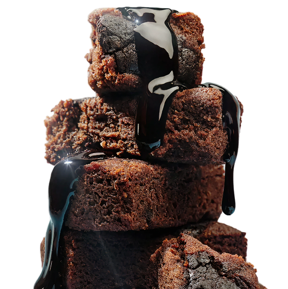 Stacked chocolate brownies drizzled with sauce