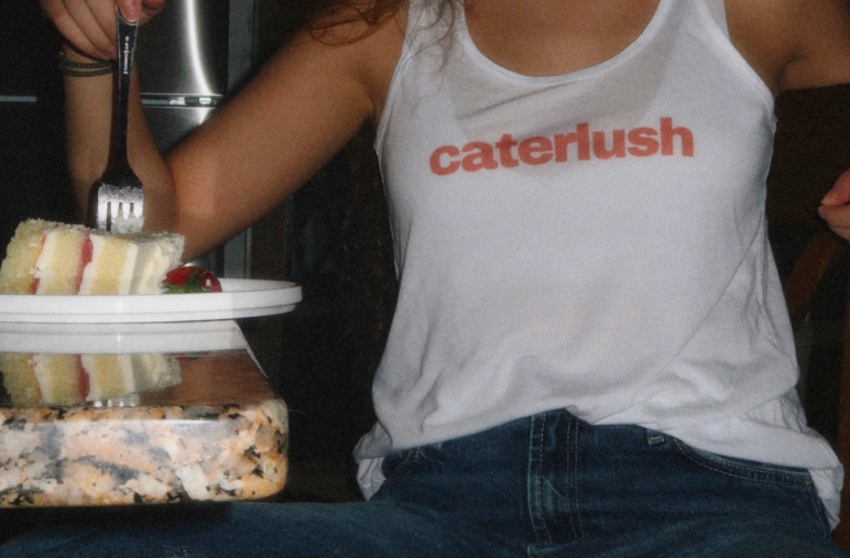 Ajla plating a dish, the beginning of the Caterlush story