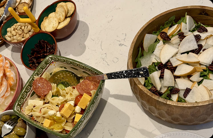 A colorful plate of homemade pasta topped with fresh herbs and grated cheese