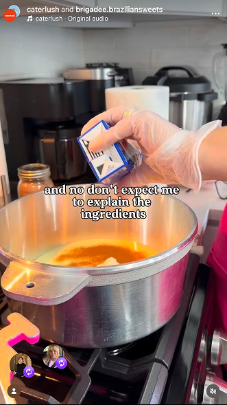 A creator seasoning a pan of curry in a home kitchen